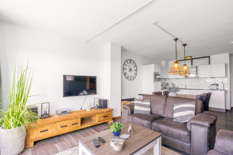 Modern living room and kitchen in Apartment Juliana 094 Island and Sea View, De Koog, Texel with stylish interior.