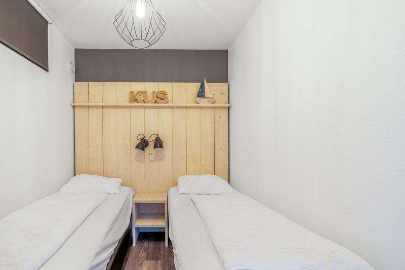 Second bedroom in Apartment Juliana 094 Island and Sea View, De Koog, Texel with two single beds.