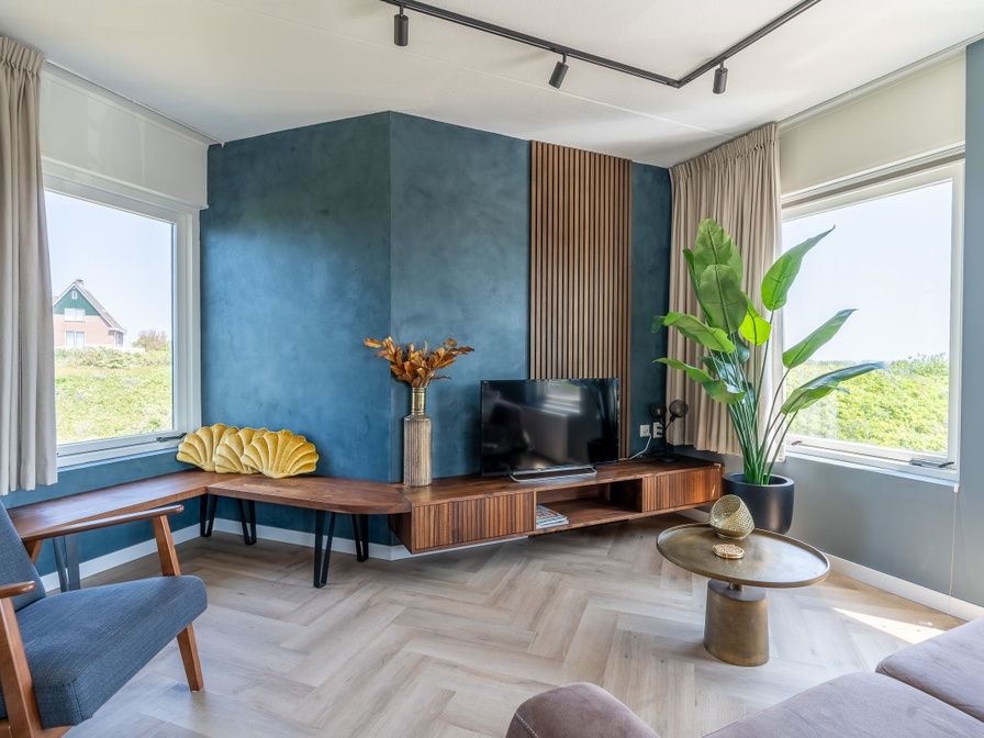Stylish living room in Apartment Juliana 120 Eilandzicht, De Koog, Texel with modern interior and large windows.