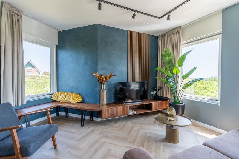 Cozy sitting area in Apartment Juliana 120 Eilandzicht, De Koog, Texel with a view of nature.