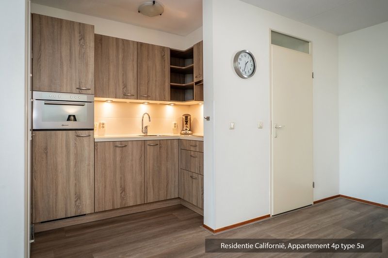 Stijlvolle woonkamer in Type 5A vakantiewoning, De Koog, Texel met gezellige zithoek.