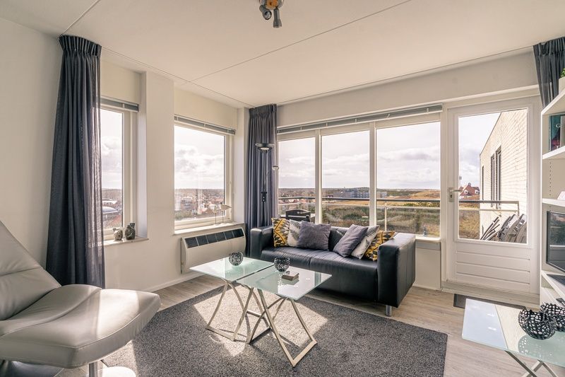 Modern furnished living room of Apartment Juliana 132 Eilandzicht in De Koog, Texel overlooking the dunes.