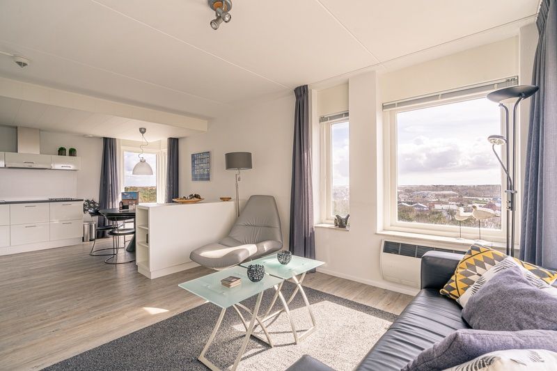 Spacious open kitchen and living room in Apartment Juliana 132 Eilandzicht, De Koog, Texel with lots of natural light.