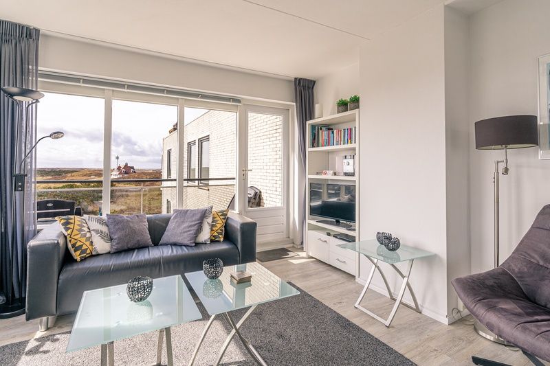 Cozy living room with views of Texel nature at Apartment Juliana 132 Eilandzicht in De Koog, Texel.