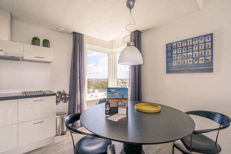Dining area with modern kitchen in Apartment Juliana 132 Eilandzicht, De Koog, Texel, perfect for cozy meals.