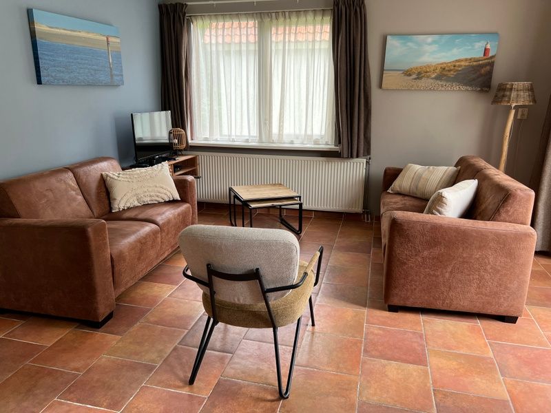 Gezellige woonkamer in Landgoed Springtij - Koetshuis 3, vakantiehuis in De Koog, Texel.
