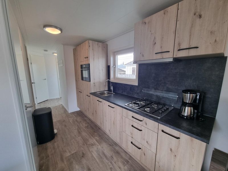 Fully equipped kitchen in Chaletpark Bregkoog - Chalet 240 De Texelse Berg, De Koog, Texel with modern appliances.