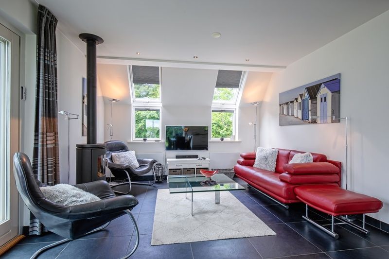 Gezellige binnenruimte van vakantiehuis Uit Zicht in Den Burg, Texel.