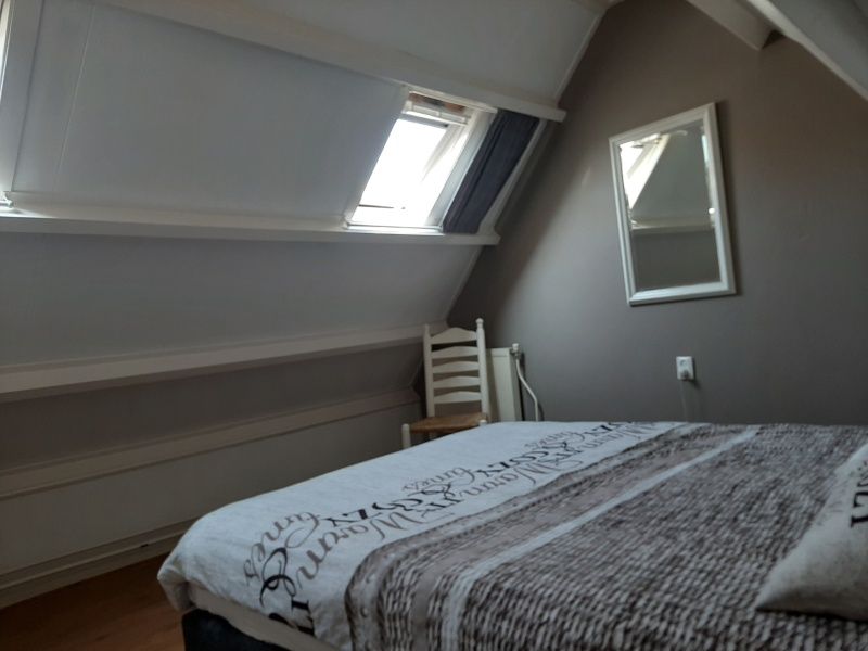 Bedroom with skylight in De Molen, vacation home in Den Burg, Texel for a fresh start.