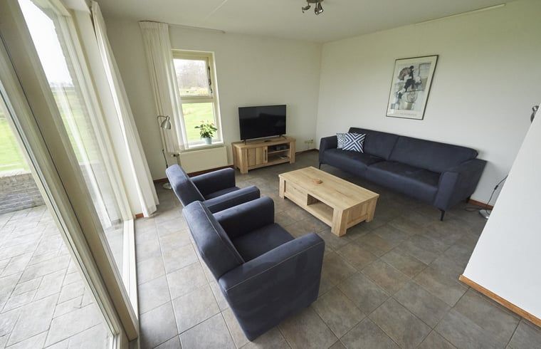 Woonkamer met comfortabele banken in Vakantiehuis in Den Burg, Texel