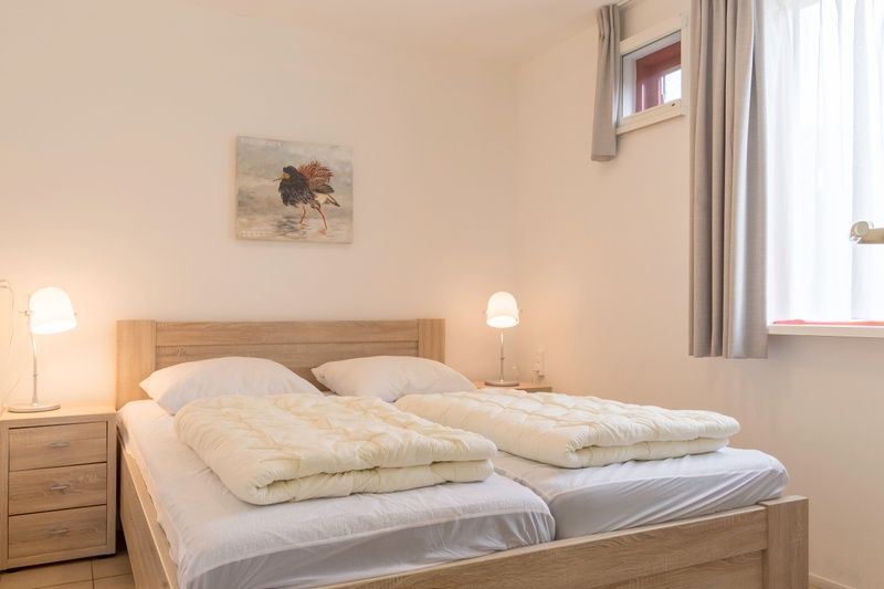 Comfortable bedroom in Type I - No. 49 Kragenmaker, Oosterend Texel, vacation home with double bed on the Wadden Islands.
