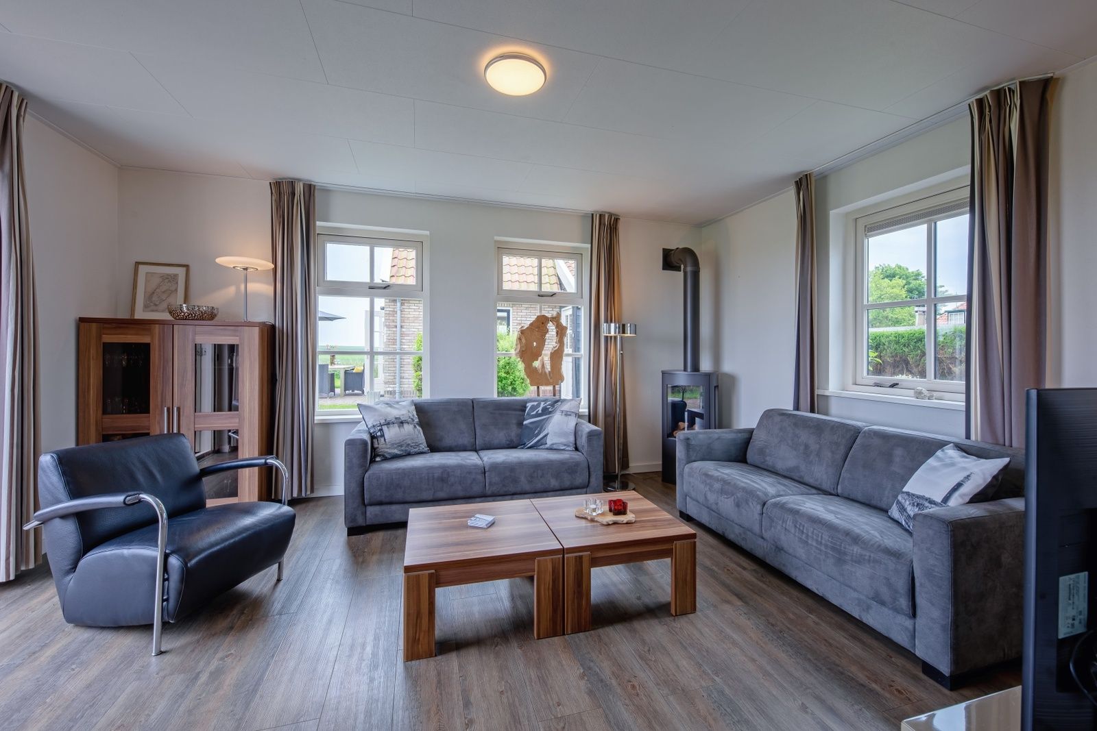 Gemuetliches Wohnzimmer des Ferienhauses De Waddenschelpjes - De Mossel in Oosterend, Texel.