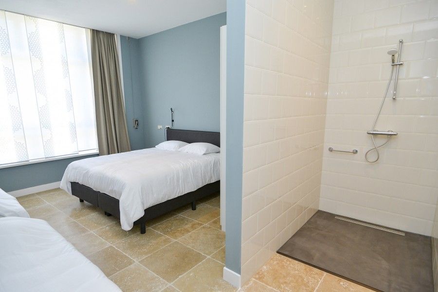 Spacious bedroom with modern bathroom at Bed & Bed, the perfect bed and breakfast on Texel, Wadden Islands.