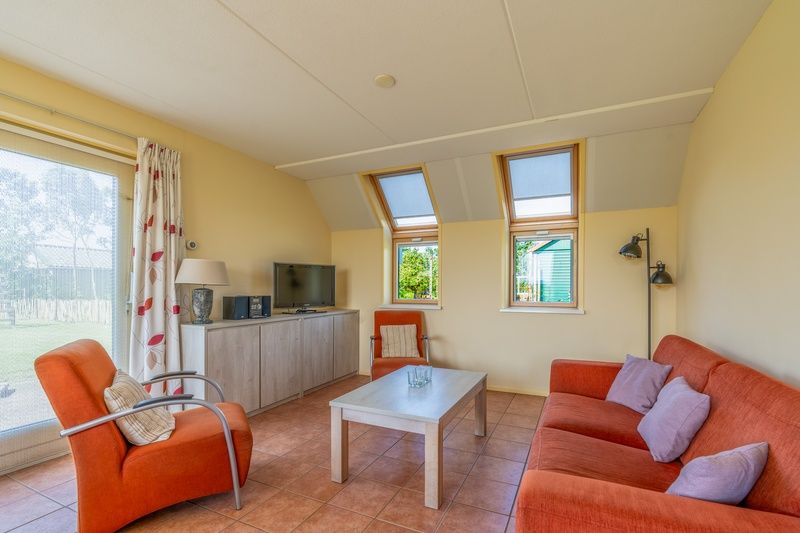 Cozy living room in The Five Star Holiday Home South Eierland Texel with comfortable seating.