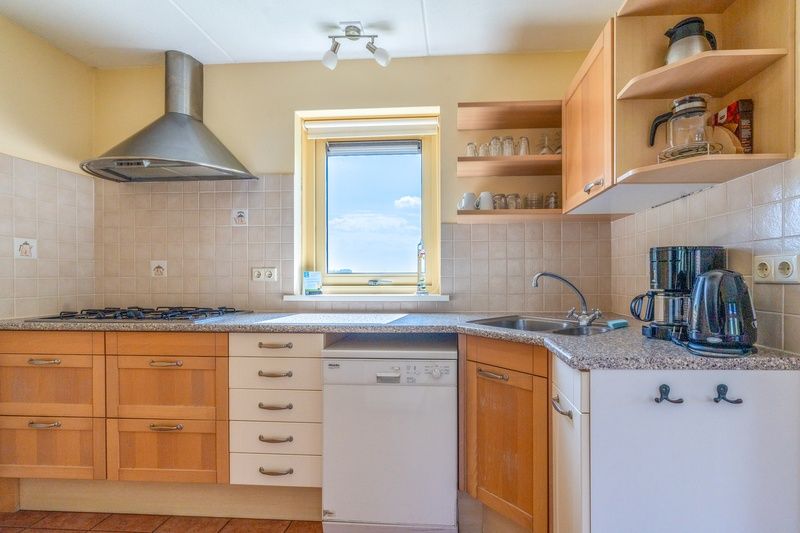 Fully equipped kitchen in The Five Star Holiday Home South Eierland Texel with modern appliances.
