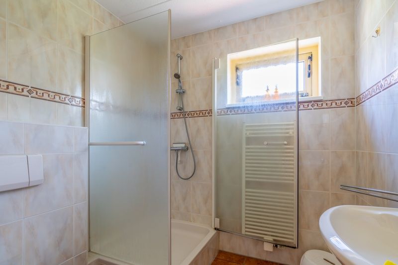 Stylish bathroom in The Five Star Holiday Home South Eierland Texel with shower and sink.