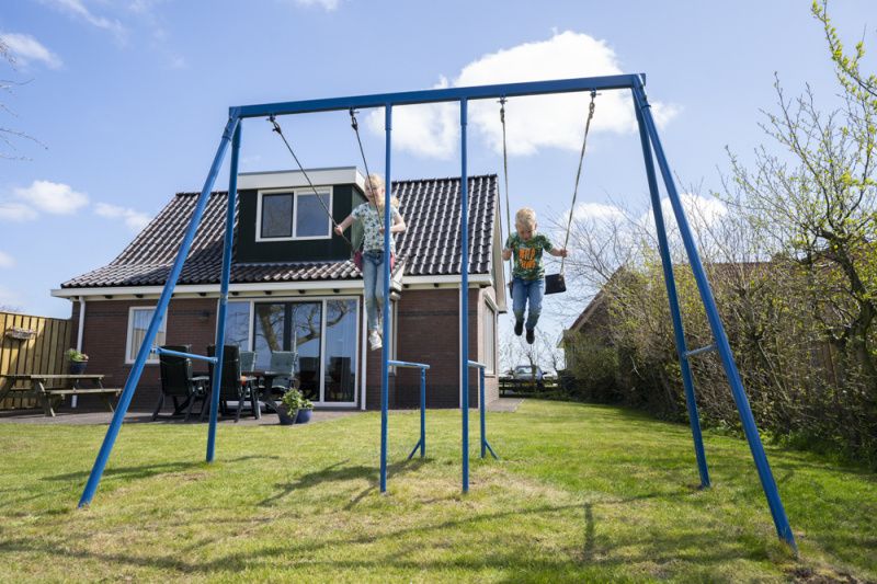 Children play on swing at Duunkruud in South Eierland, Texel.