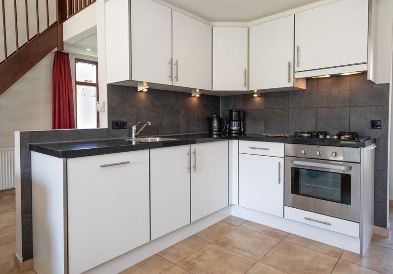 Dining area in Holiday home Gortersmient 270, De Dennen, Texel with lots of natural light.