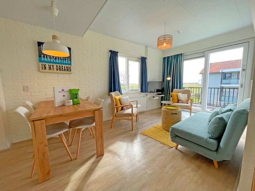 Gezellige woonruimte in Appartement Bos en Duin 29, De Dennen, Texel met uitzicht op Waddeneilanden.
