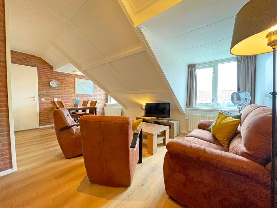 Cozy living room in Apartment Bos en Duin 34, De Dennen, Texel with comfortable seating area.