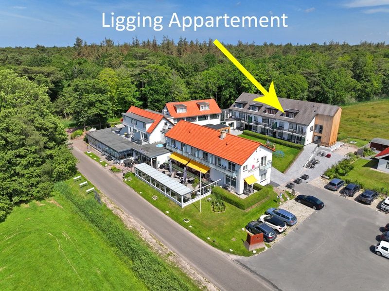 Aerial view of Apartment Bos en Duin 34, De Dennen, Texel with green surroundings.
