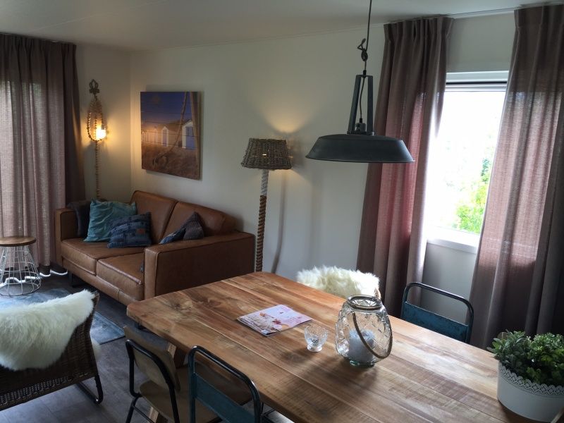 Cozy living room in Chalet Weideveld 80, Vakantiepark de Bremakker, Texel. Comfortable interior in De Dennen, Wadden Islands.