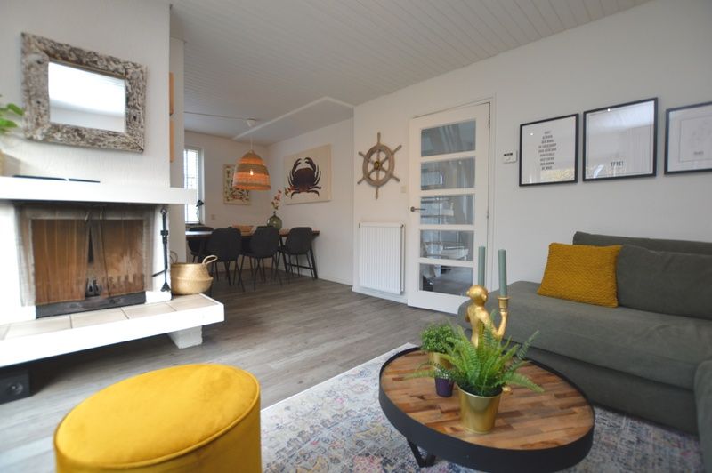 Interior of Gerritslanderdijkje 146 - Salty Dog, Texel with fireplace and dining area in De Dennen.