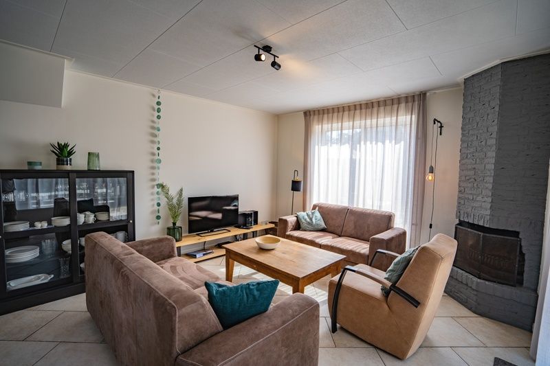 Comfortable sitting area in Holiday Home 't Hoogelandt 136A, De Dennen, Texel with lots of daylight.