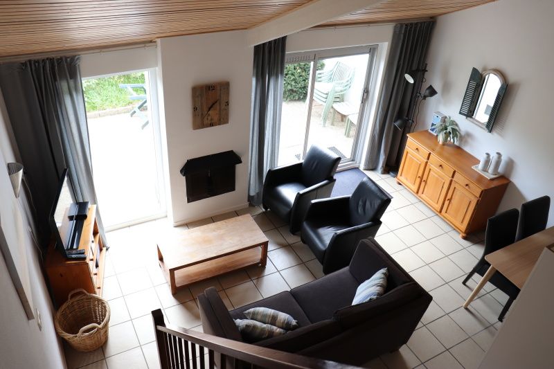 Cozy living room of Holiday home Gortersmient 290 in De Dennen, Texel.