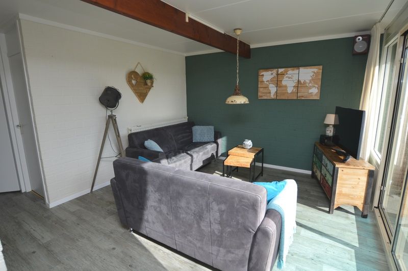 Gezellige woonkamer in Bungalow Verste Coogh 66, vakantiehuis in De Dennen, Texel.