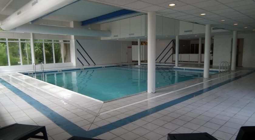 Indoor swimming pool in Apartment Amelander-Kaap TIME-OUT with SWIMMING POOL, Hollum, Ameland, ideal for swimming enthusiasts.