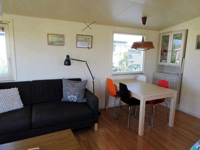 Bright living room of De Doorloper chalet in Midsland Noord, Terschelling with modern decor on the Wadden Islands.