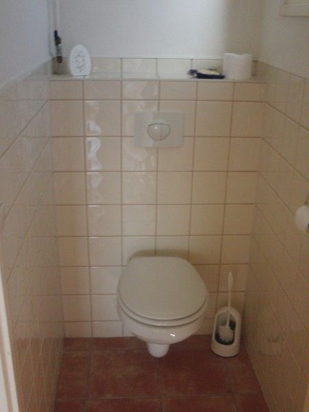 Modern bathroom with toilet in De Doorloper chalet, Midsland Noord, Terschelling on the Wadden Islands.