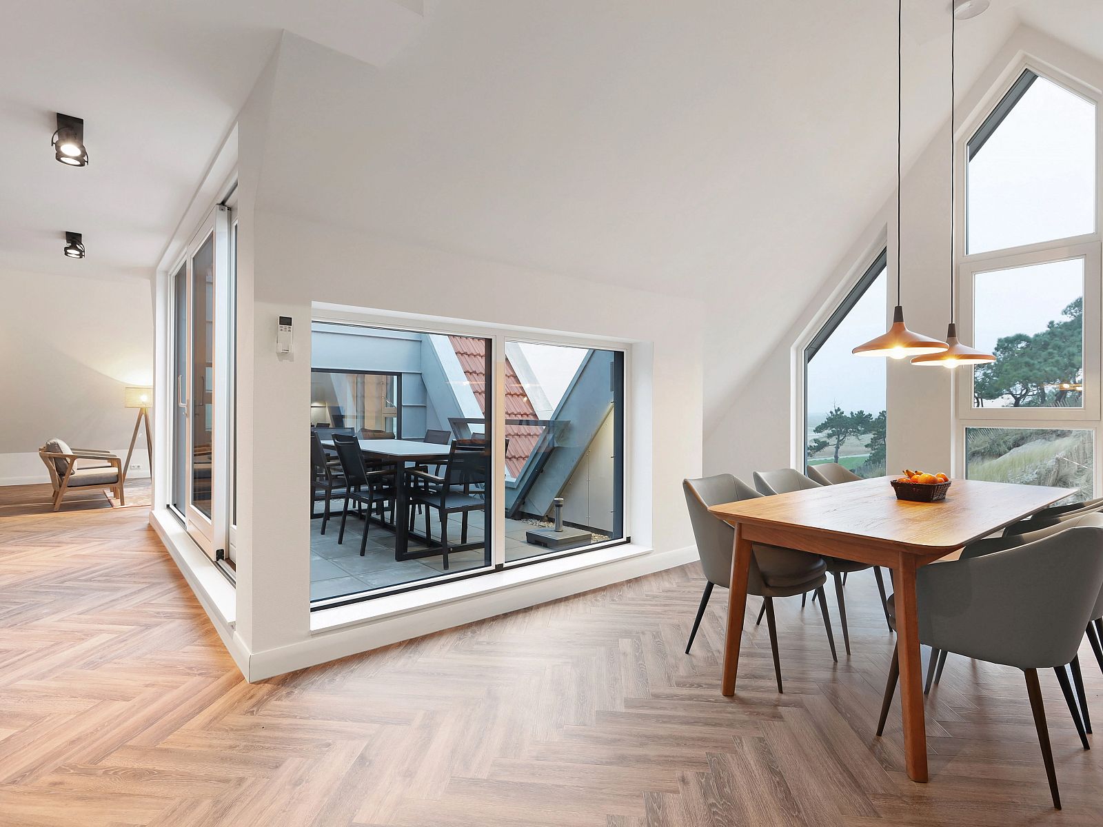 Open kitchen and dining area in 6-person penthouse 6LP, West-Terschelling, Wadden Islands with modern design.