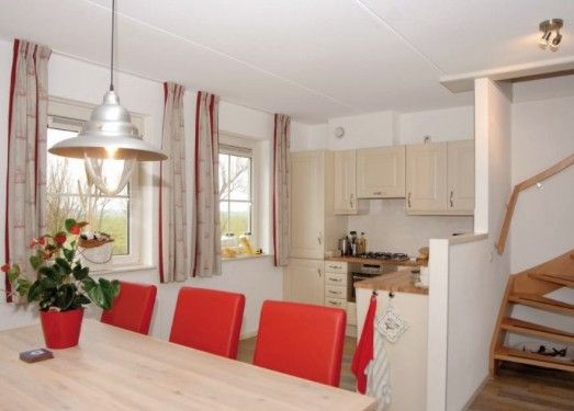 Kitchen and dining area in WEIDEVILLA B 6, Hollum, Ameland, vacation home with modern amenities.