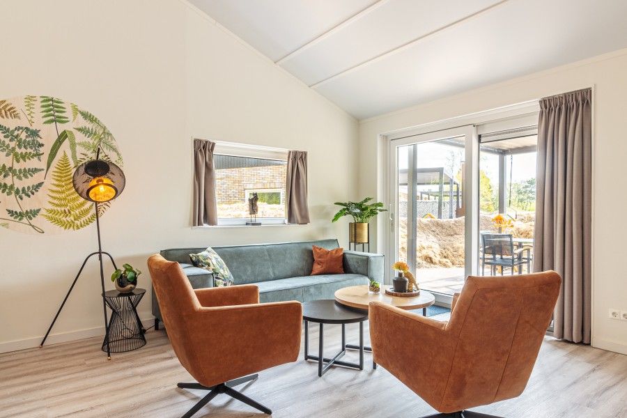 Cozy living room of Nesserduinen 42D, vacation home in Nes, Ameland with comfortable seating area.