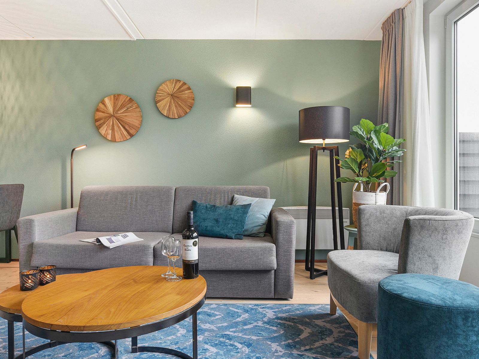 Wine and glasses on the table at Ameland State 4-person apartment in Nes, Ameland.