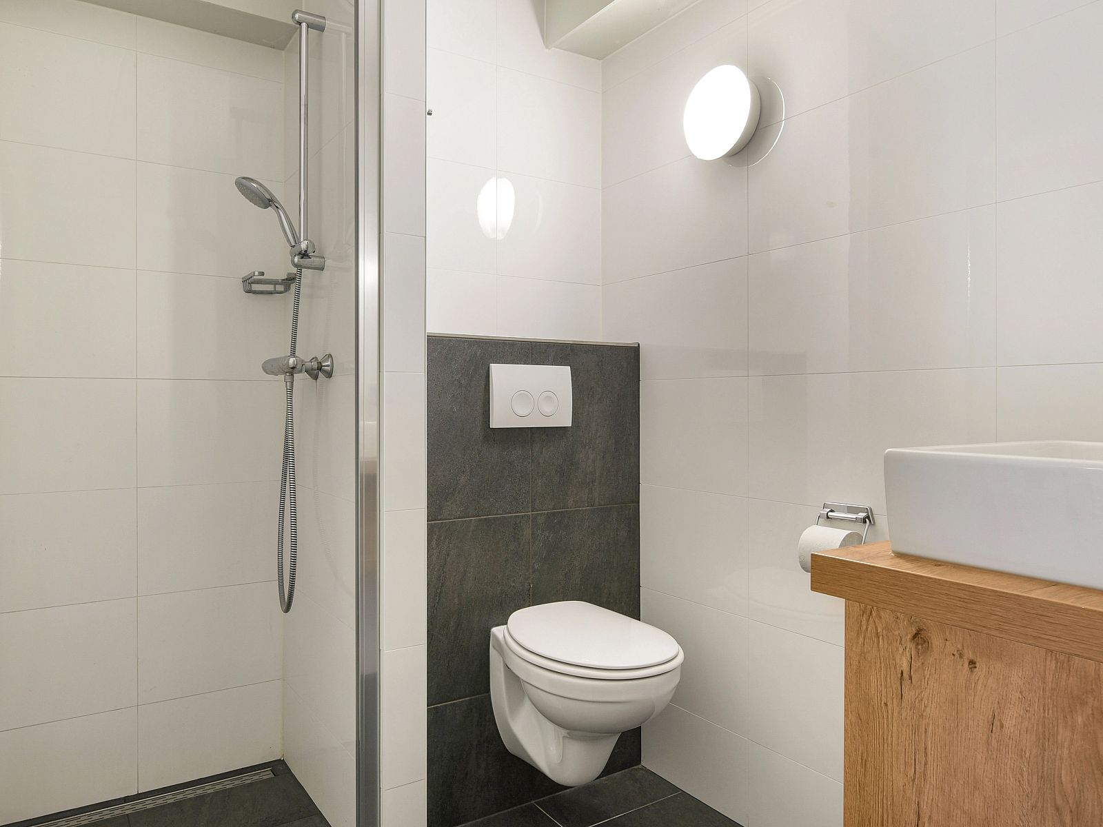 Balcony with seating and views of greenery in Ameland State 4-person apartment in Nes, Ameland.