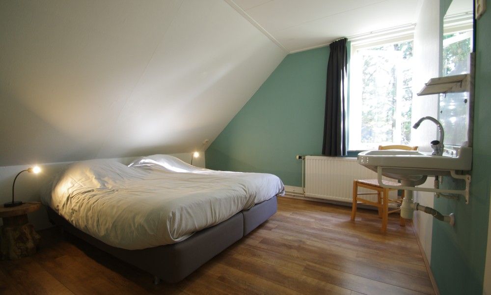 Comfortable bedroom in Louwtjesduin Oost vacation home, Schiermonnikoog.