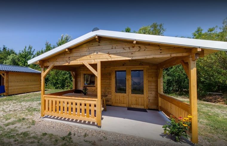 Cozy porch of Holiday home in Workum, located on the IJsselmeer among the Frisian lakes, perfect for a relaxing stay.