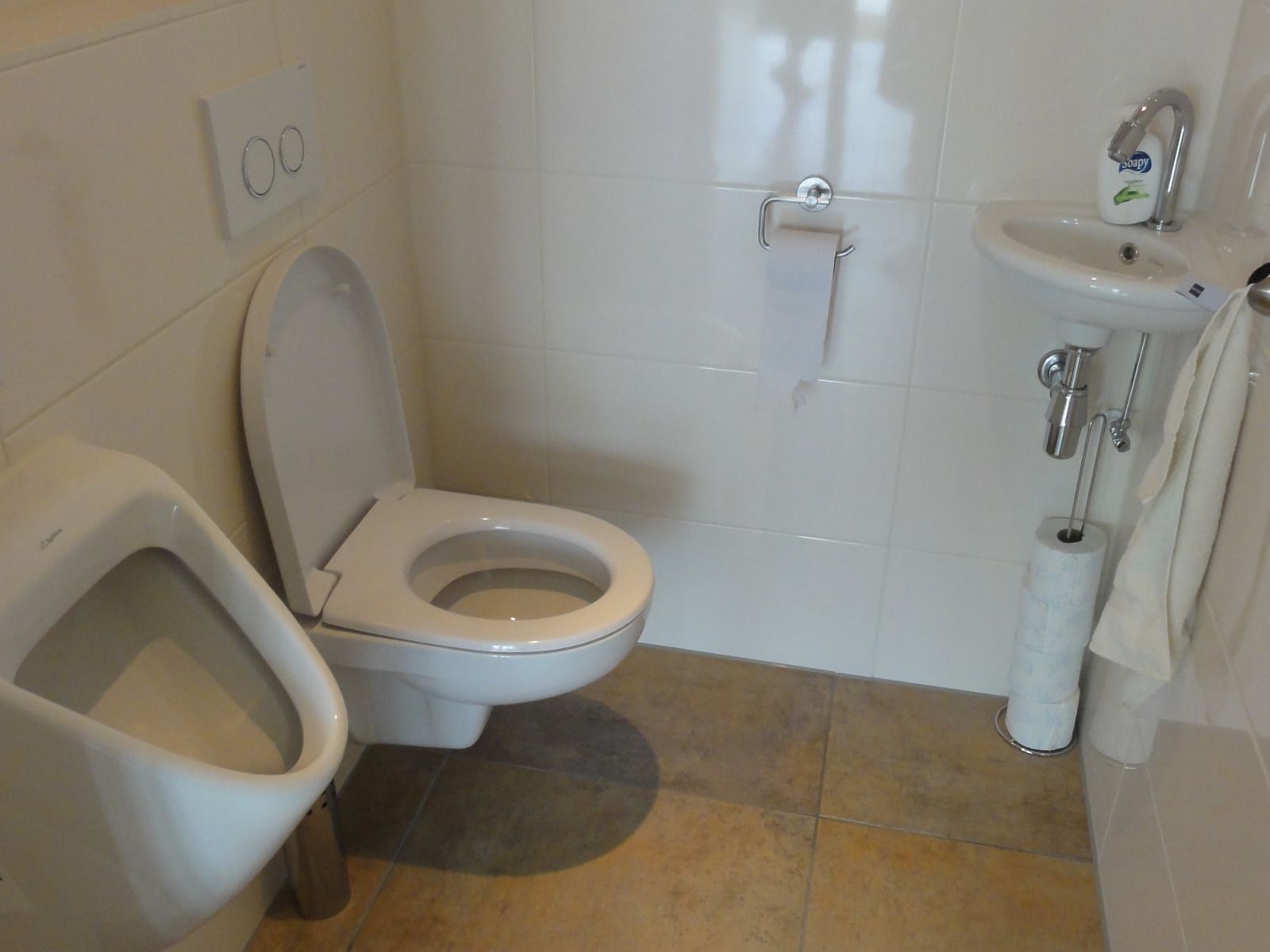 Sunlit terrace of vacation home FR518, Koudum, overlooking water.