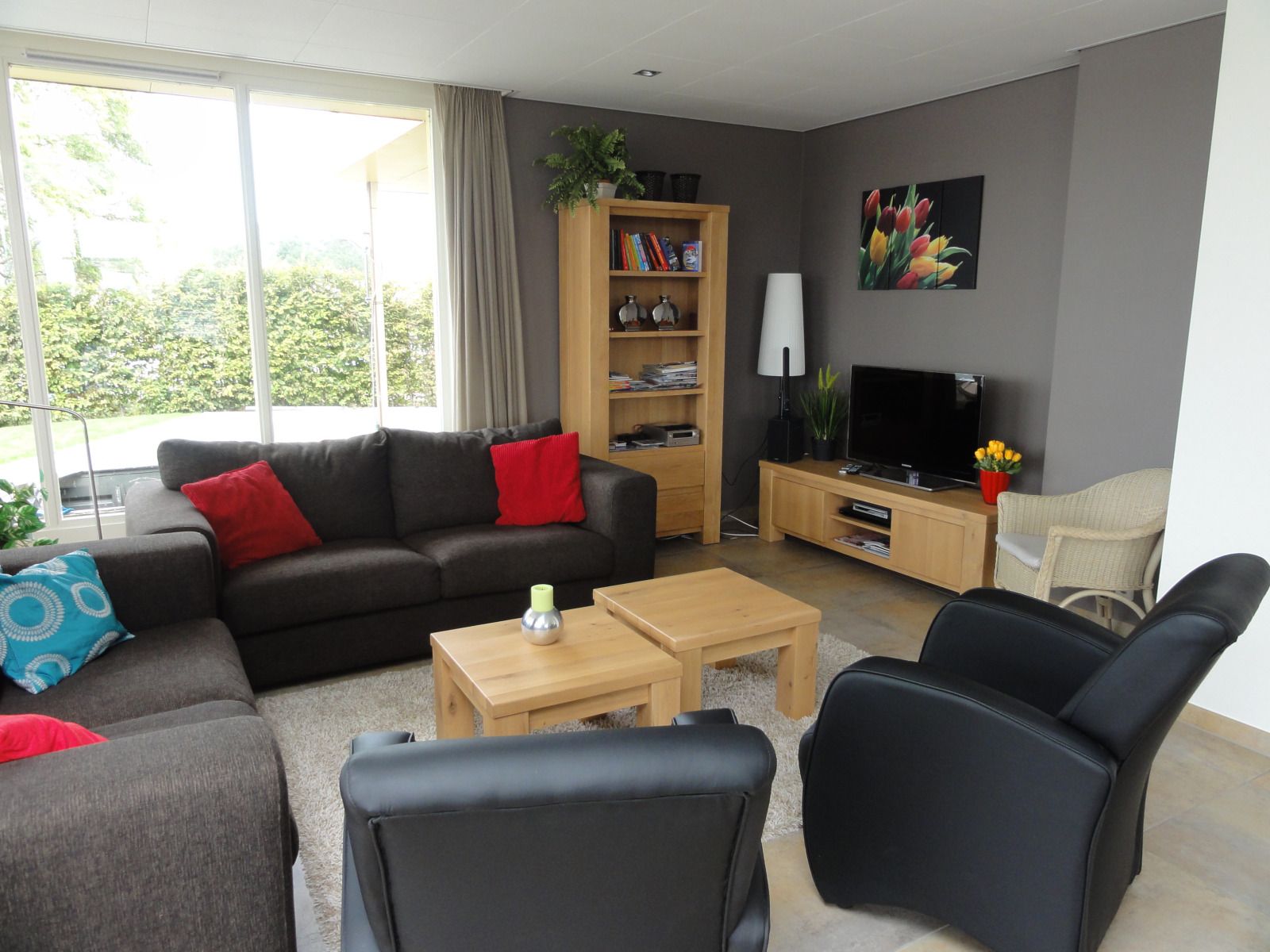 Terrace with sunshade at vacation home FR518 in Koudum, overlooking water.