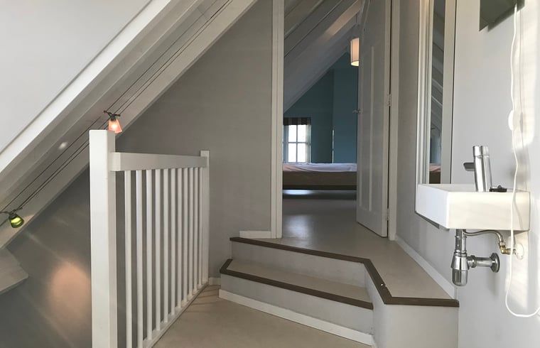 Cozy hallway in Holiday Home in Kollumerpomp, Lauwersmeer, with access to cozy bedrooms.