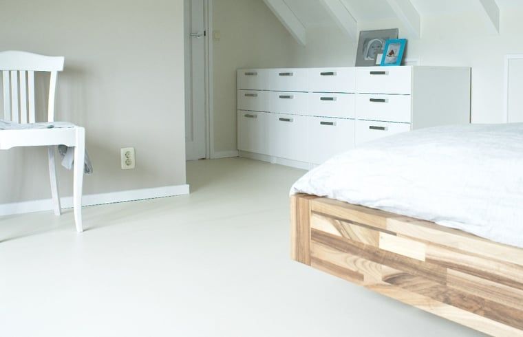 Minimalist bedroom in Holiday Home in Kollumerpomp, Lauwersmeer, with sleek furniture and bright atmosphere.