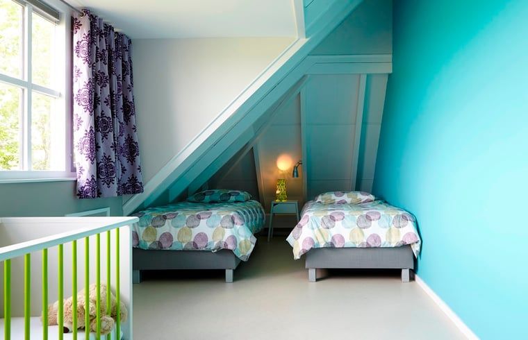 Cozy children's room in Holiday Home in Kollumerpomp, Lauwersmeer, with cheerful colors and comfortable beds.