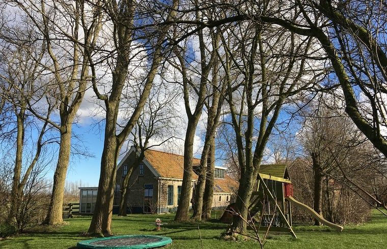 Outdoor playground at Holiday home in Kollumerpomp, Lauwersmeer, surrounded by nature and suitable for children.