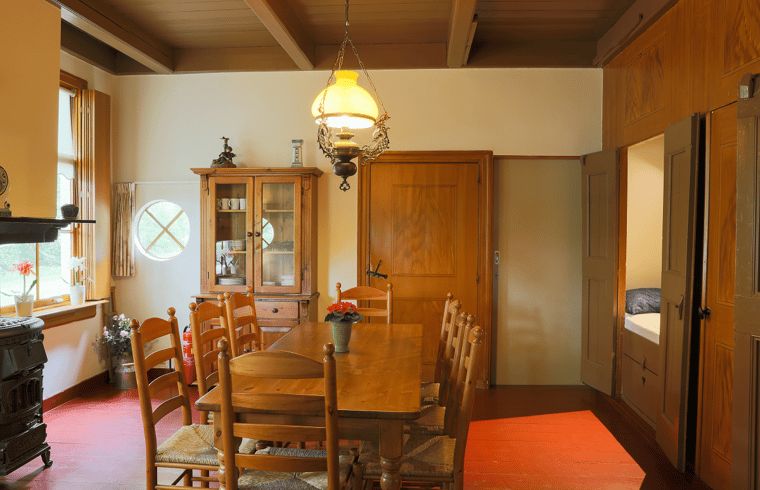 Spacious dining area in vacation home in Orvelte, Central Drenthe, with country decor.