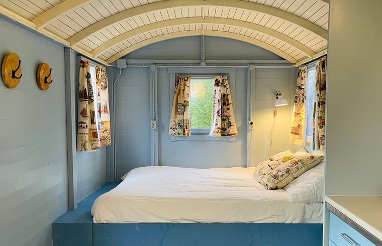 Cozy bedroom in Cottage in Papenvoort, Central Drenthe, with rustic interior and natural light.