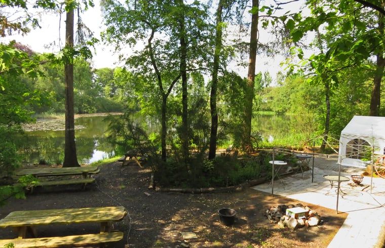 Enjoy the serenity of nature at Cottage in Papenvoort, a vacation home in Central Drenthe, overlooking a beautiful forest lake.