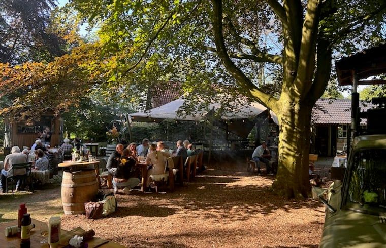 Outdoor dining at Holiday Home in Mantinge, a cozy vacation location in Midden Drenthe, Drenthe.